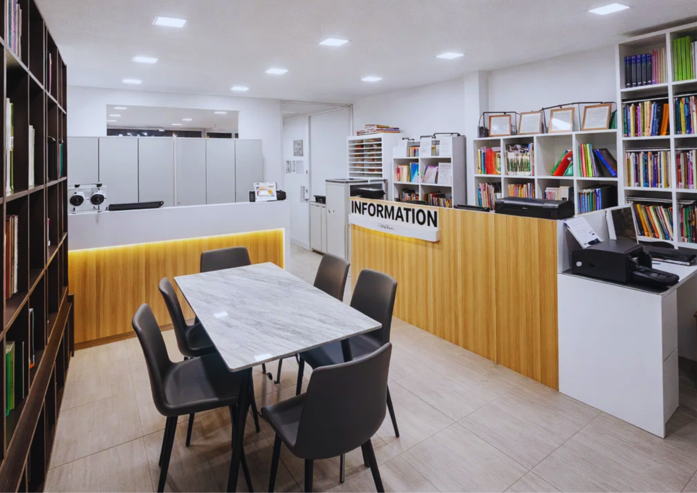 Educational Areas - BELA E4U Academy admin office. It is filled with English learning books for all courses, a meeting table, and staff tables. It is where the head teacher is. At the back is the CCTV location